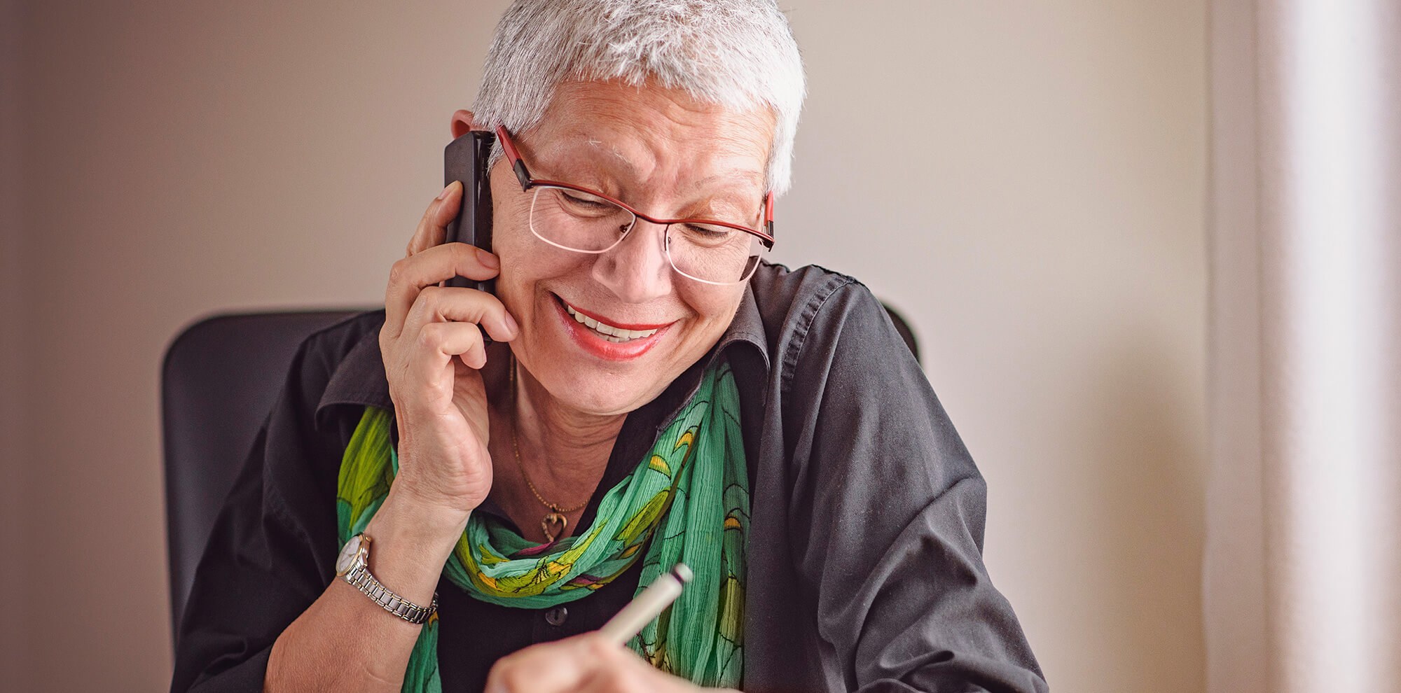 Happy senior woman wearing glasses